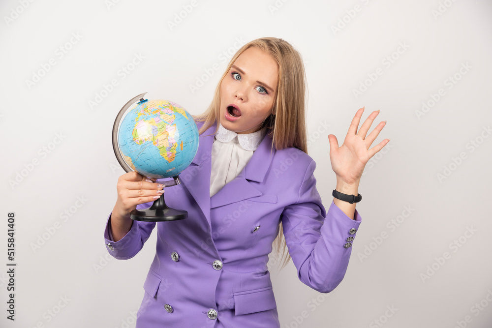 Woman teacher with globe posing on white background Woman teacher with globe posing on white background