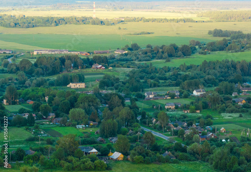 Village wooden house. Country houses in countryside, aerial view. Rural building and farmhouse in countryside. Сountry House. Suburban house in rural. Roofs of village home. Agricultural development.