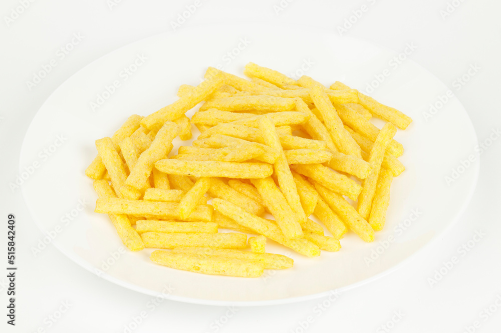 French fries on a white plate, fatty fast food. French fries on a white plate, fatty fast food.