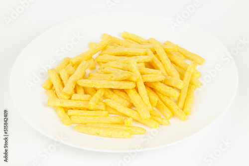 French fries on a white plate, fatty fast food.