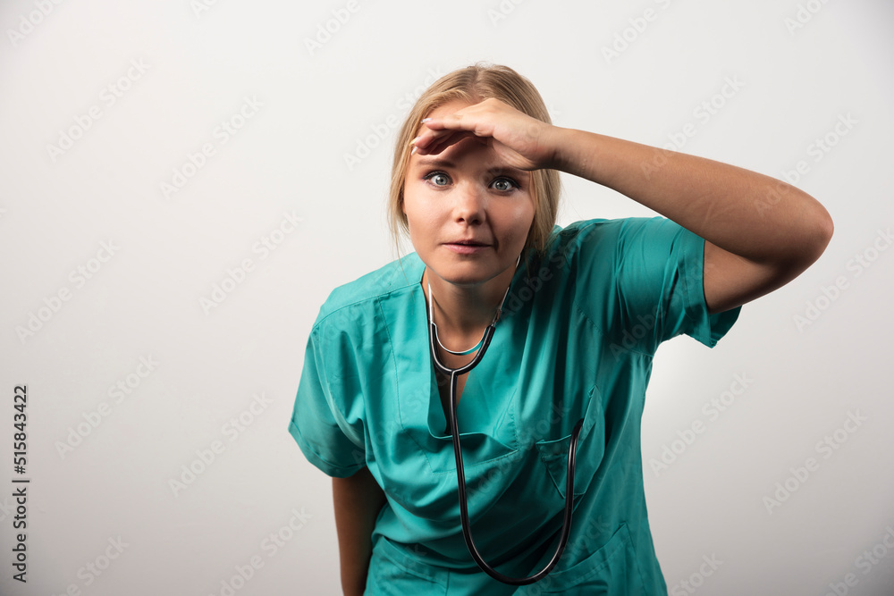 Female doctor looking at front on white background Female doctor looking at front on white background