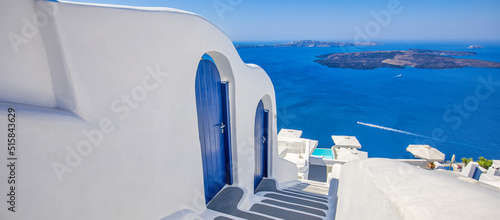 Amazing panoramic landscape, luxury travel vacation. Oia town stairs, blue doors on Santorini island, Greece. Traditional and famous houses and churches with blue domes over the Caldera, Aegean sea