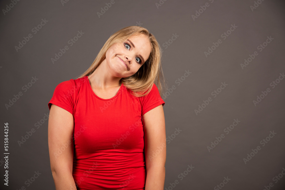 Portrait of funny woman posing over dark background Portrait of funny woman posing over dark background
