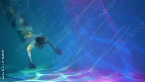 Slow Motion Woman in a sequin dress underwater