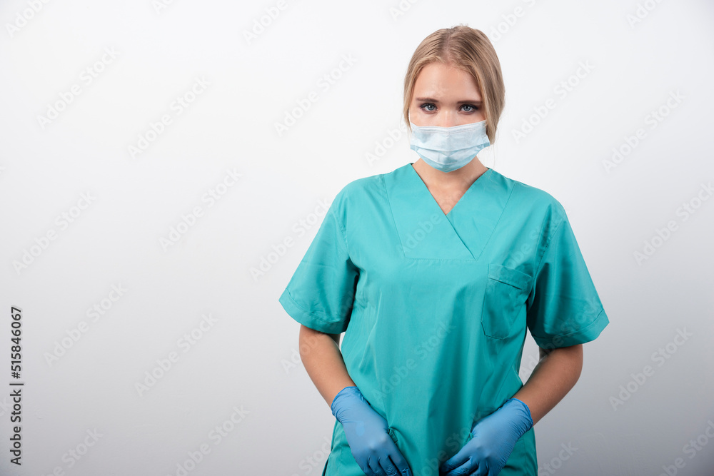 Woman doctor with latex gloves and medical mask Woman doctor with latex gloves and medical mask
