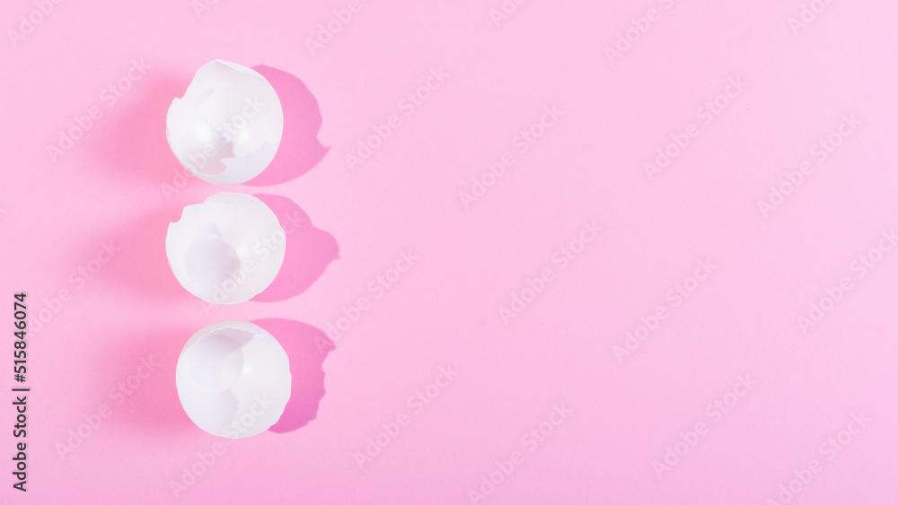 Creative happy easter, food card, egg white shell on a pink background.