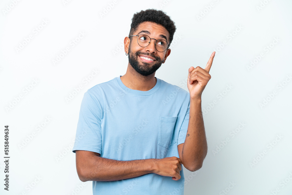 Young Brazilian man isolated on white background pointing up a great idea