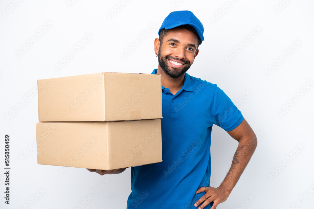 Delivery Brazilian man isolated on white background posing with arms at hip and smiling Delivery Brazilian man isolated on white background posing with arms at hip and smiling