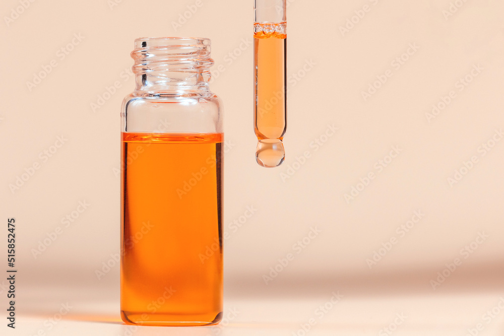 Pipette with a glass bottle on a light background. Pipette with a glass bottle on a light background.