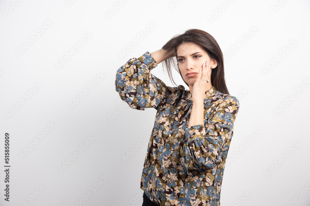 Brunette woman standing on a white background Brunette woman standing on a white background