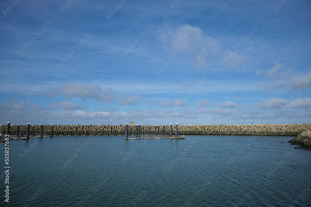 Dutch dike by the North Sea made of concrete stones, Netherlands