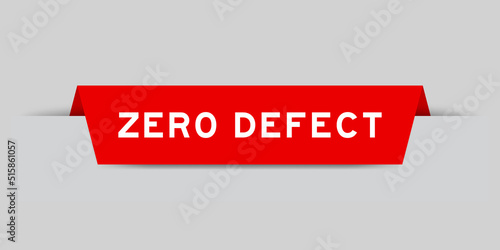 Red color inserted label with word zero defect on gray background