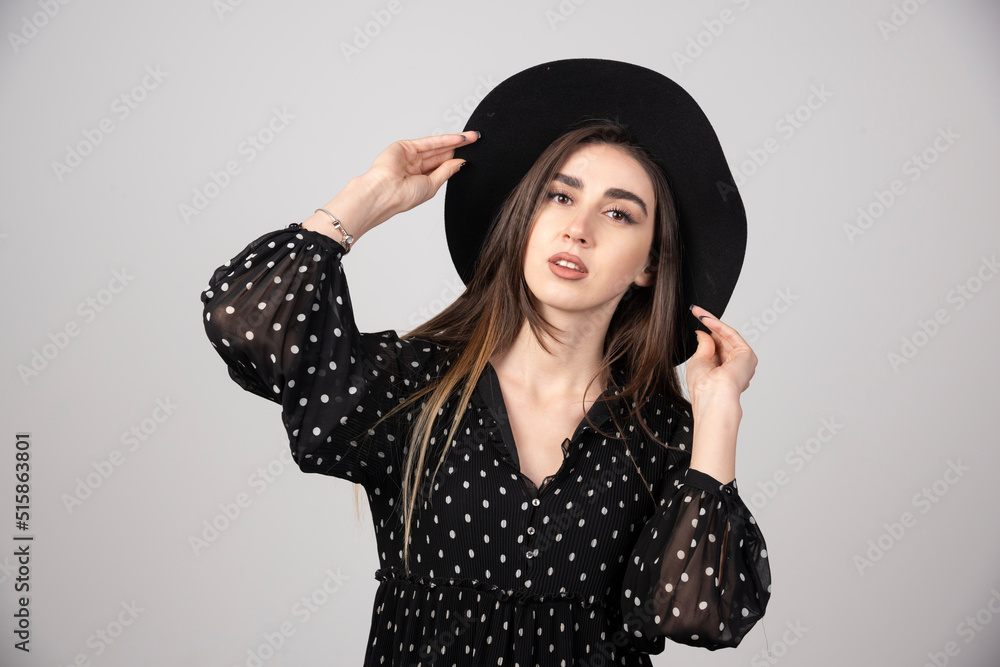 Young woman in black dress looking at camera Young woman in black dress looking at camera