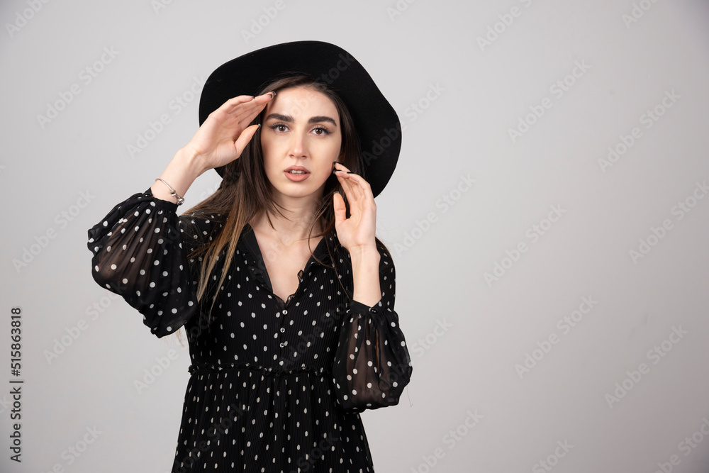 Young woman in black dress looking at camera Young woman in black dress looking at camera