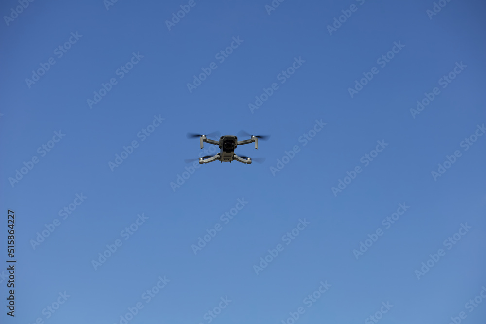 Flying drone in the sky. Drone flight, drone photography, aerial photography Flying drone in the sky. Drone flight, drone photography, aerial photography