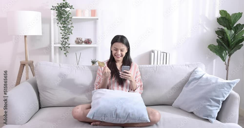 Young Asian woman holding credit card and using smart phone, Online shopping. Young Asian woman holding credit card and using smart phone, Online shopping.
