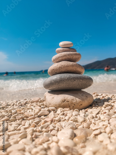 woman in blue swimsuit at the rock sunbathing