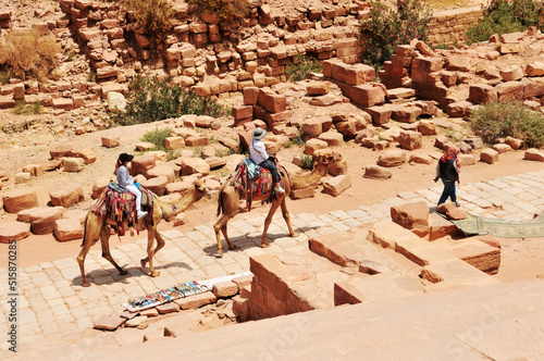 Several camel riders at Petra site in Jordan.