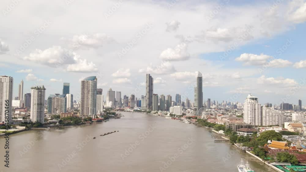 Aerial view of Chao Phraya River with Bangkok Skyscrapers Background on Cloudy day, Thailand Aerial view of Chao Phraya River with Bangkok Skyscrapers Background on Cloudy day, Thailand
