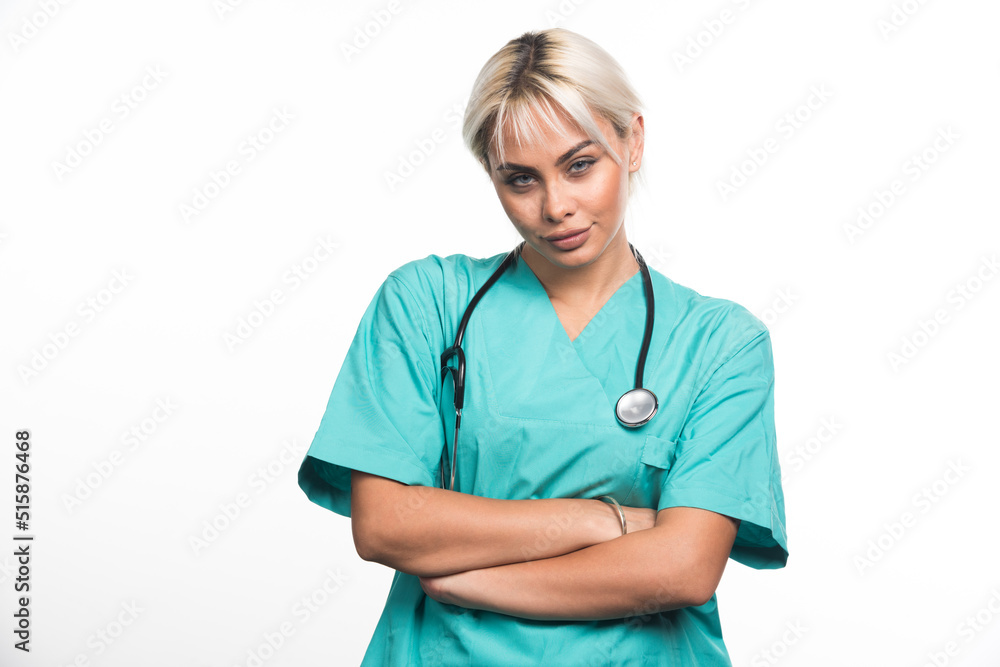Female doctor with stethoscope crossing arms on white background Female doctor with stethoscope crossing arms on white background