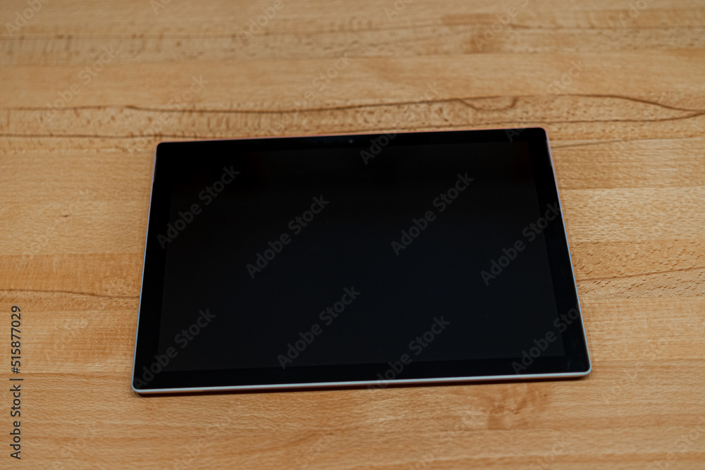 Tablet PC for Homeoffice on a Wooden Desk in Bavaria Germany Tablet PC for Homeoffice on a Wooden Desk in Bavaria Germany
