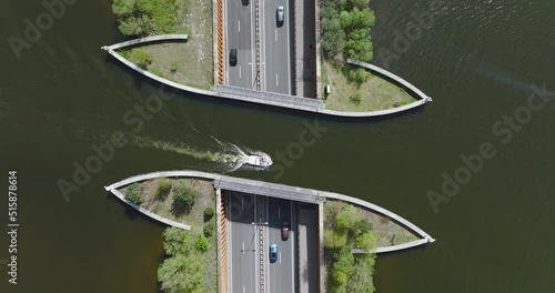 Top down view of Aquaduct Veluwemeer water bridge with Boats crossing above highway traffic.
 photo