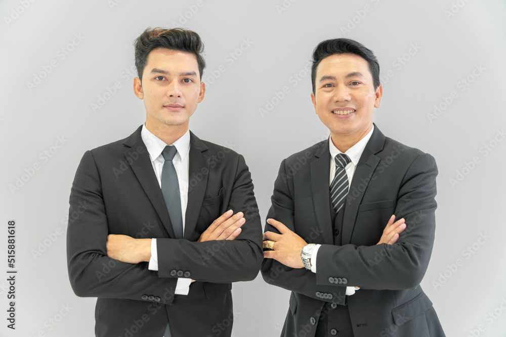 Asian businessman looking at the camera Working and meeting at the office at the company with colleagues at the back Asian businessman looking at the camera Working and meeting at the office at the company with colleagues at the back