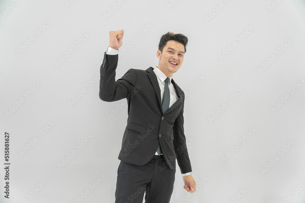 Asian businessmen in suits are gesturing with smiles and having fun. Asian businessmen in suits are gesturing with smiles and having fun.