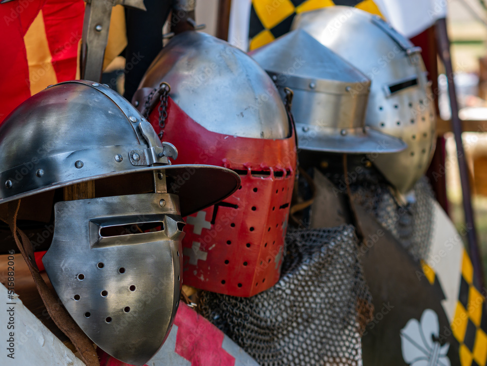 Fototapeta premium display of various types of medieval plate armor helmets