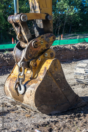 Details of excavator bucket during a road construction
