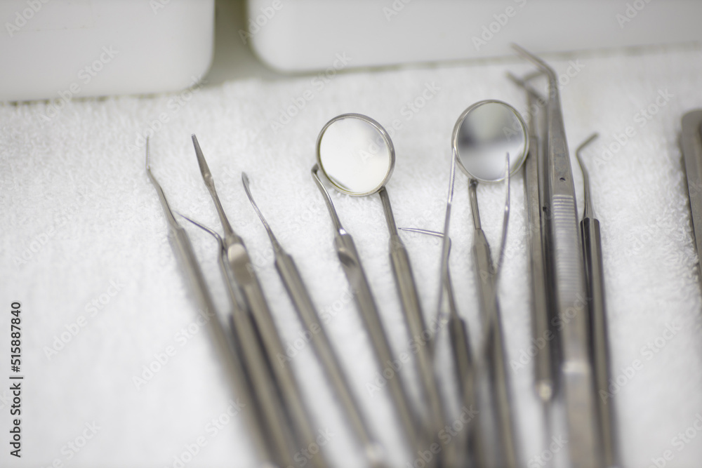 professional metal dentist tools on a tray professional metal dentist tools on a tray