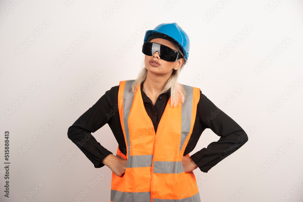 Woman builder posing with goggles and helmet Woman builder posing with goggles and helmet