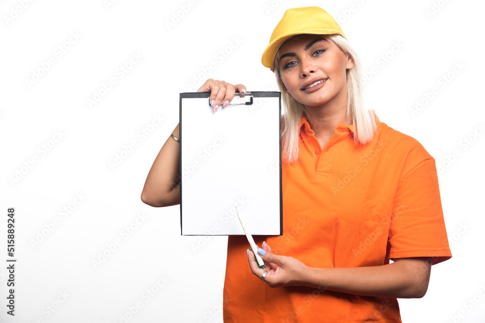 Female courier pointing at empty notebook on white background Female courier pointing at empty notebook on white background