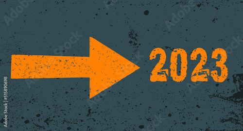 Grunge yellow arrow on gray texture pointing to 2023 next. Background 2023 New Year future vision concept.