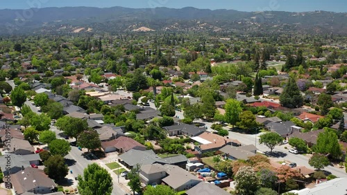 Aerial shot of suburban homes in northern California with beautiful trees 