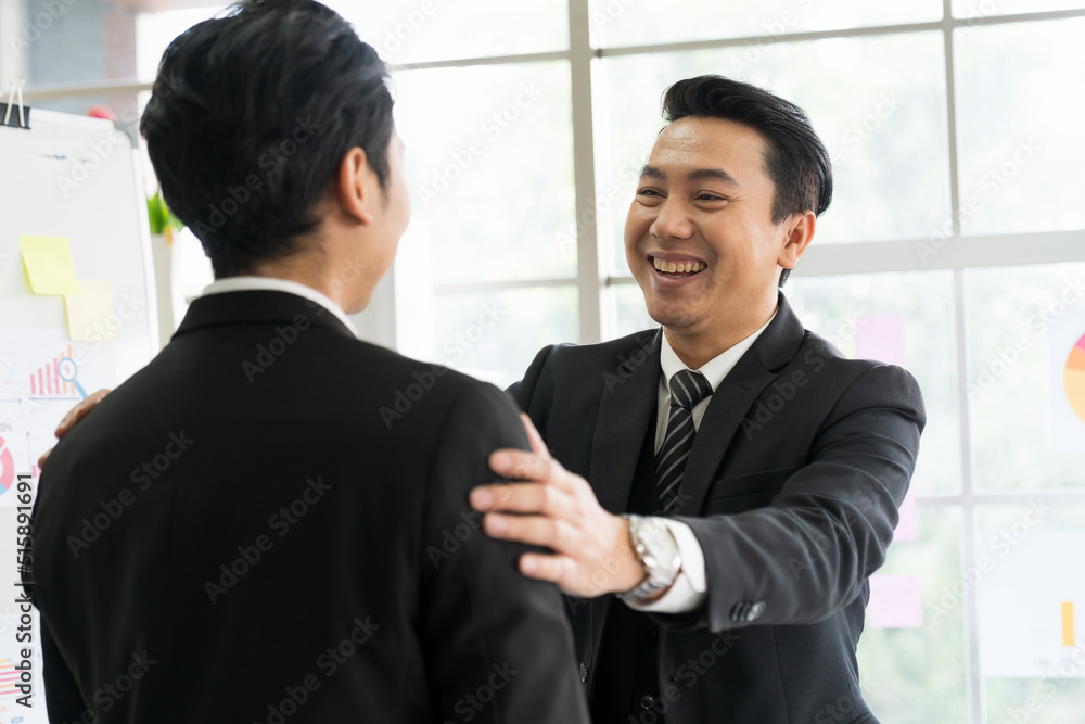 Asian business man shaking hands together after finishing up meeting in the office. Investment deal, Partnership concept. Asian business man shaking hands together after finishing up meeting in the office. Investment deal, Partnership concept.