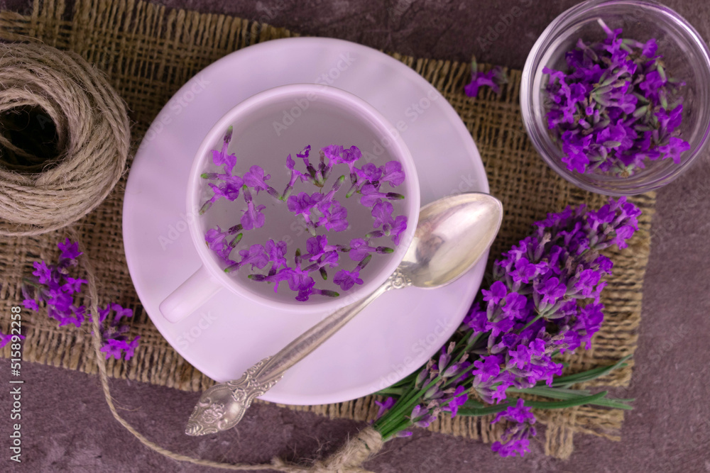 Aromatic lavender tea in a cup a bouquet of fresh lavender flowers. Flat lay. Aromatic lavender tea in a cup a bouquet of fresh lavender flowers. Flat lay.