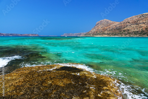 azure sea, blue sky and mountains