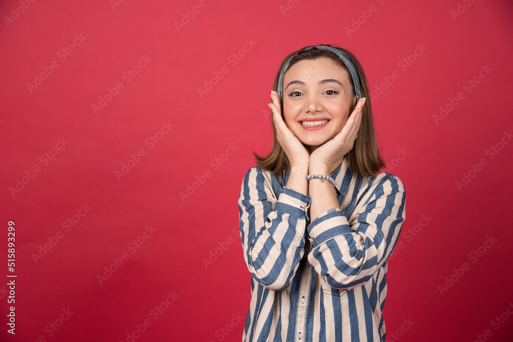 Short haired girl holding her face out of happiness Short haired girl holding her face out of happiness