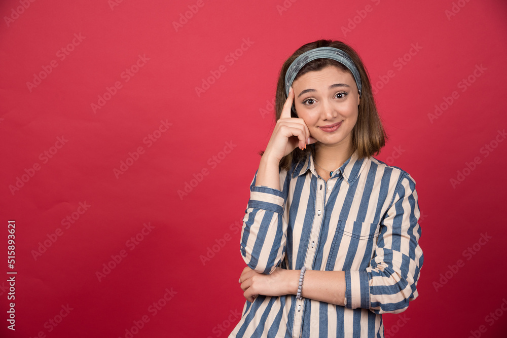 Beautiful girl with smiling expression holding her face Beautiful girl with smiling expression holding her face