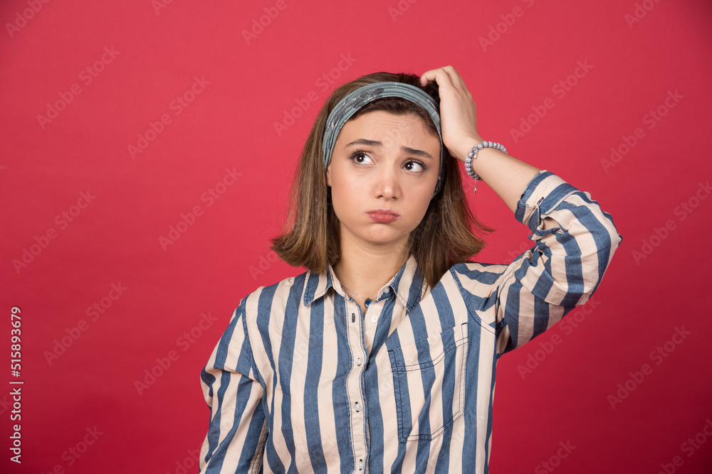 Cute girl with headband trying to remember something Cute girl with headband trying to remember something