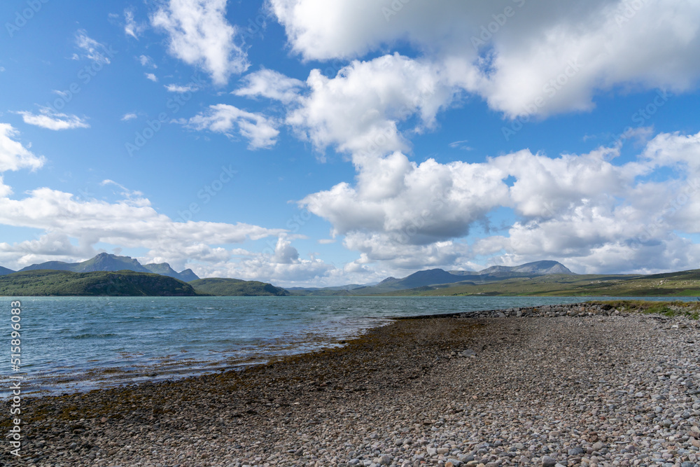 view of the rocky beach and mountains of the Kyle of Tongue on the North Coast 500 drive in the Scottish highlands