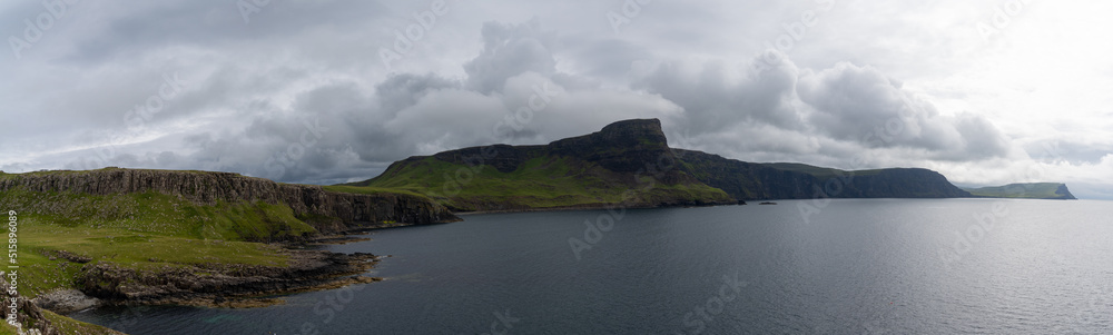 Obraz premium panorama landscape of the green cliffs on the coast of Neist Point on the Isle of Skye