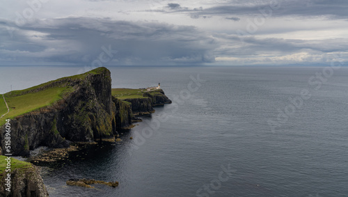 the Neist Point Lighthouse on the green cliffs of the Isle of Skye