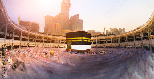 Crowd of people making Tawaf around The Holy Kaaba in Makkah during Umra or Hajj, View from the top of Masjid Al Haram. Long Exposure at night photo