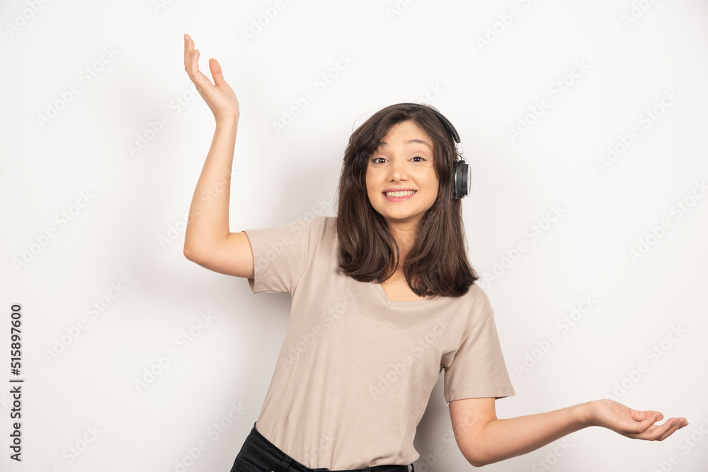 Young woman in headphones on white background Young woman in headphones on white background