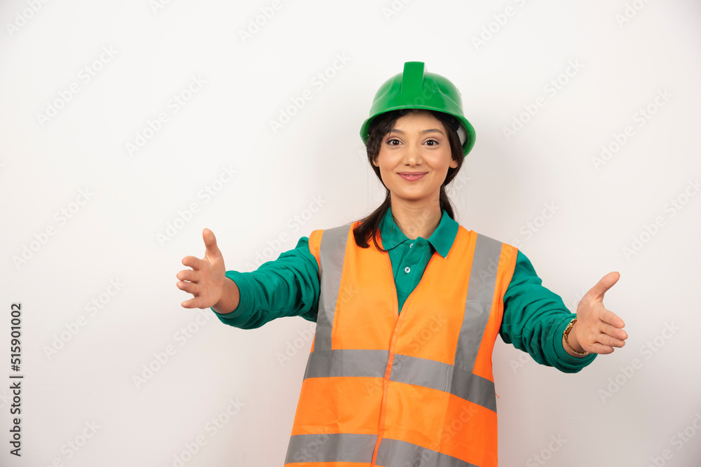 Young female construction worker on white background Young female construction worker on white background