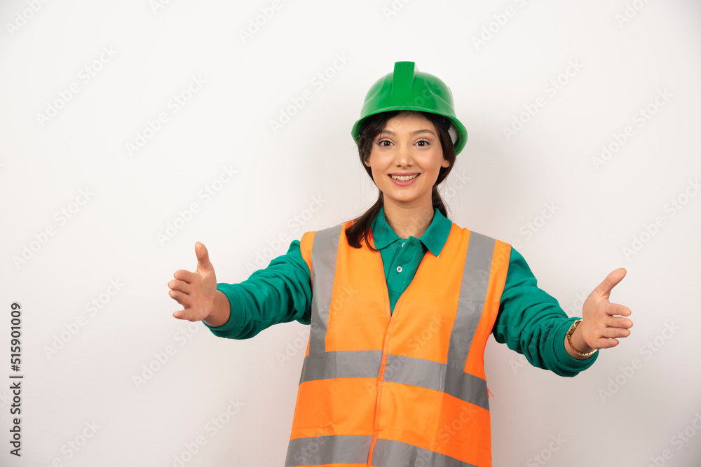 Young female construction worker on white background Young female construction worker on white background