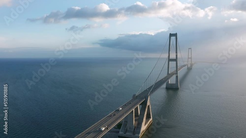 Aerial view on the famous Great Belt suspension bridge (Østbroen) in Denmark, a multi-element fixed link crossing the Great Belt strait between the Danish islands of Zealand and Funen photo