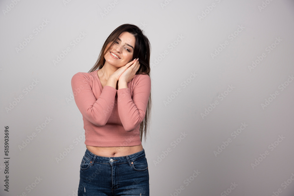 Smiling woman standing and looking down Smiling woman standing and looking down